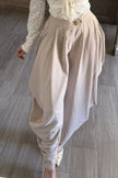 Pantalón harem beige de tiro alto vista de frente Jash Online
