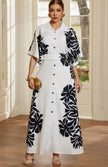 Vestido largo camisero blanco con estampado floral negro vista de frente Jash Online